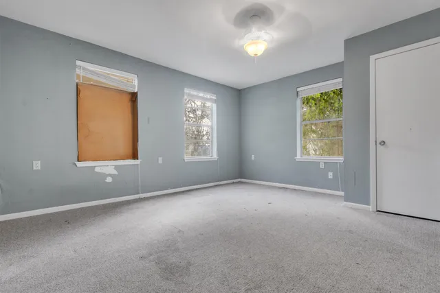 an empty room with windows