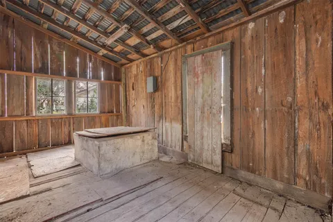 a view of an outdoor space with wooden floor