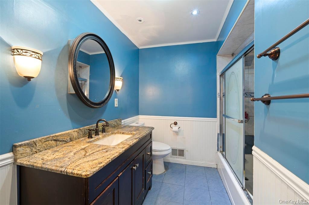41 Woodcrest Road Staten Island, NY 10303 - Photo 11 of 21 a bathroom with a sink and a mirror