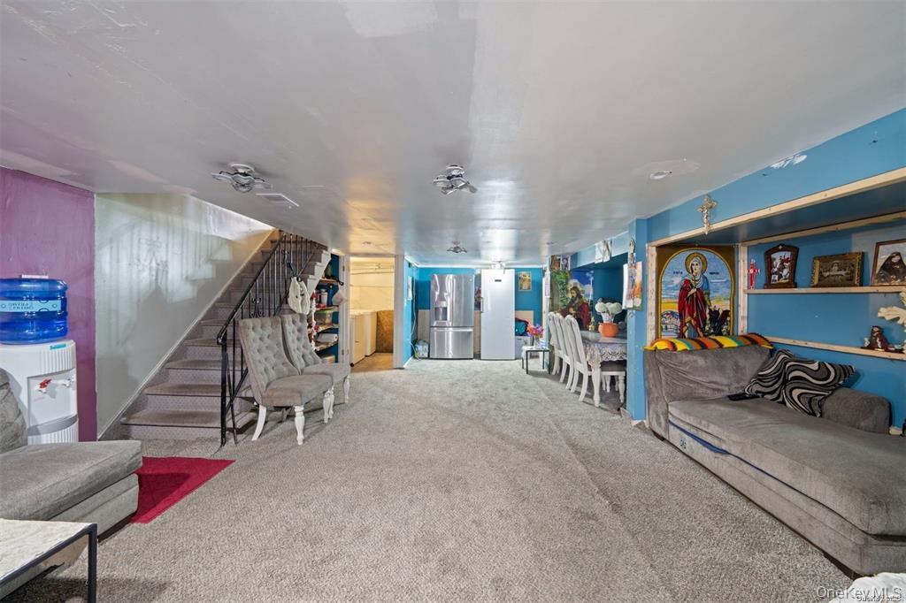 41 Woodcrest Road Staten Island, NY 10303 - Photo 12 of 21 a view of livingroom with furniture and stairs