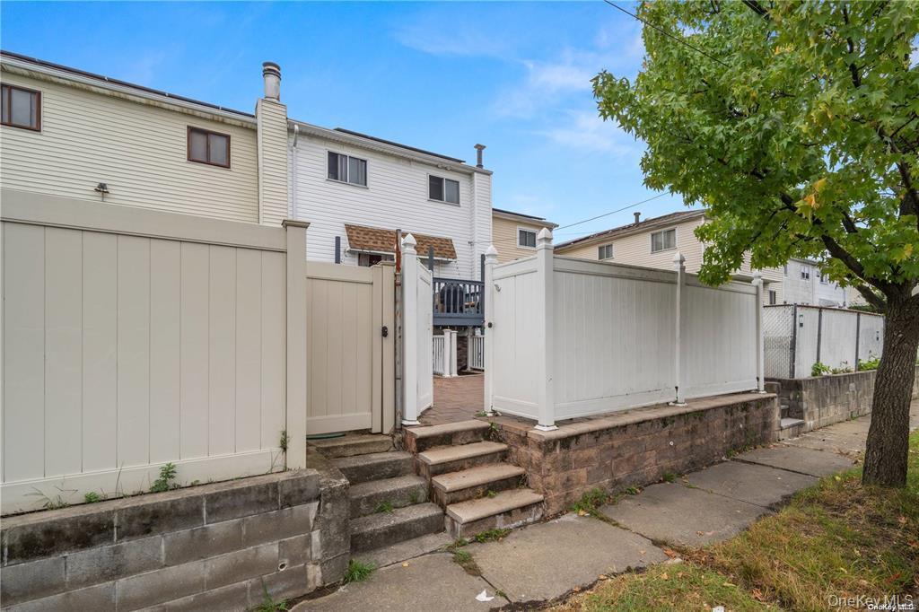 41 Woodcrest Road Staten Island, NY 10303 - Photo 16 of 21 a view of a house with a backyard