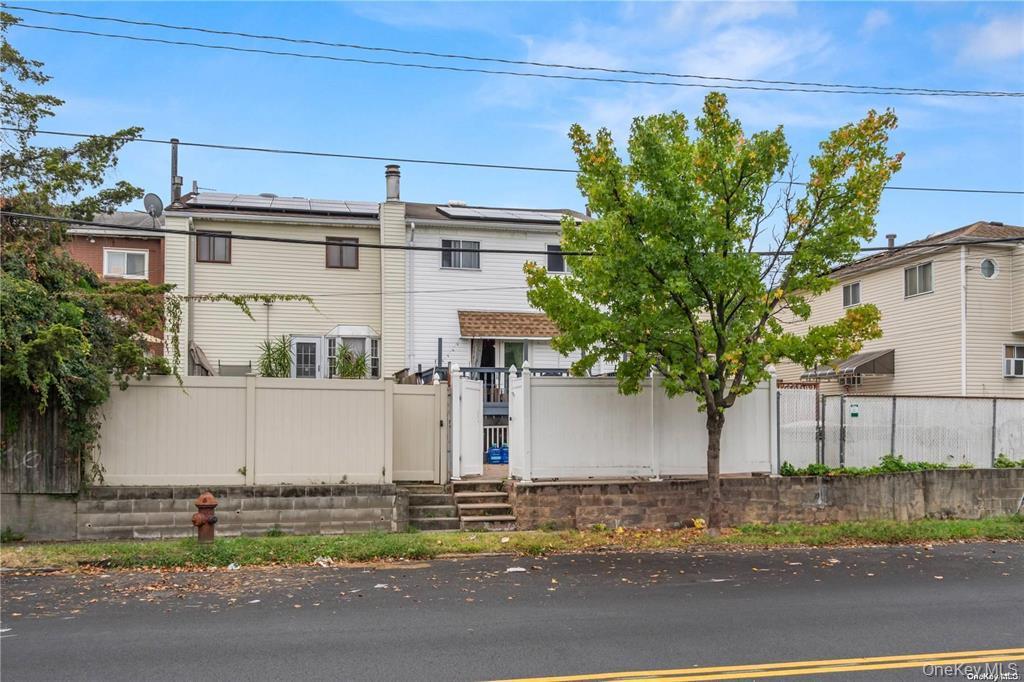 41 Woodcrest Road Staten Island, NY 10303 - Photo 20 of 21 a front view of a house with a yard and garage