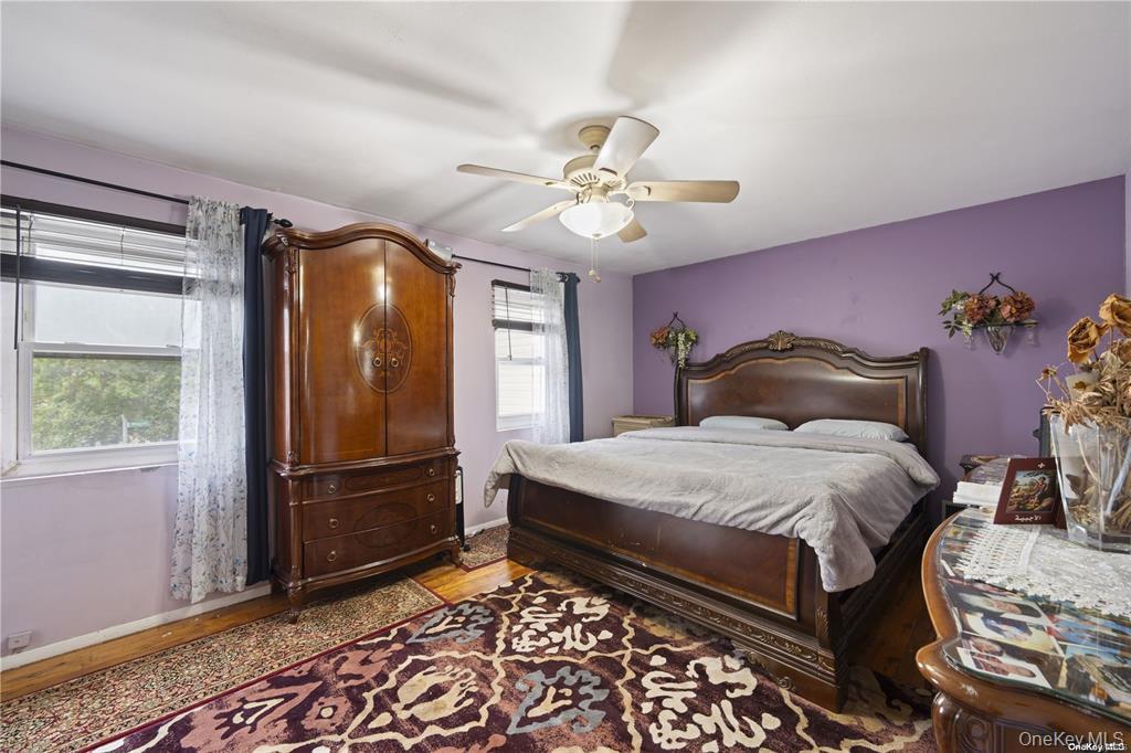 41 Woodcrest Road Staten Island, NY 10303 - Photo 8 of 21 a bedroom with a bed and a chandelier
