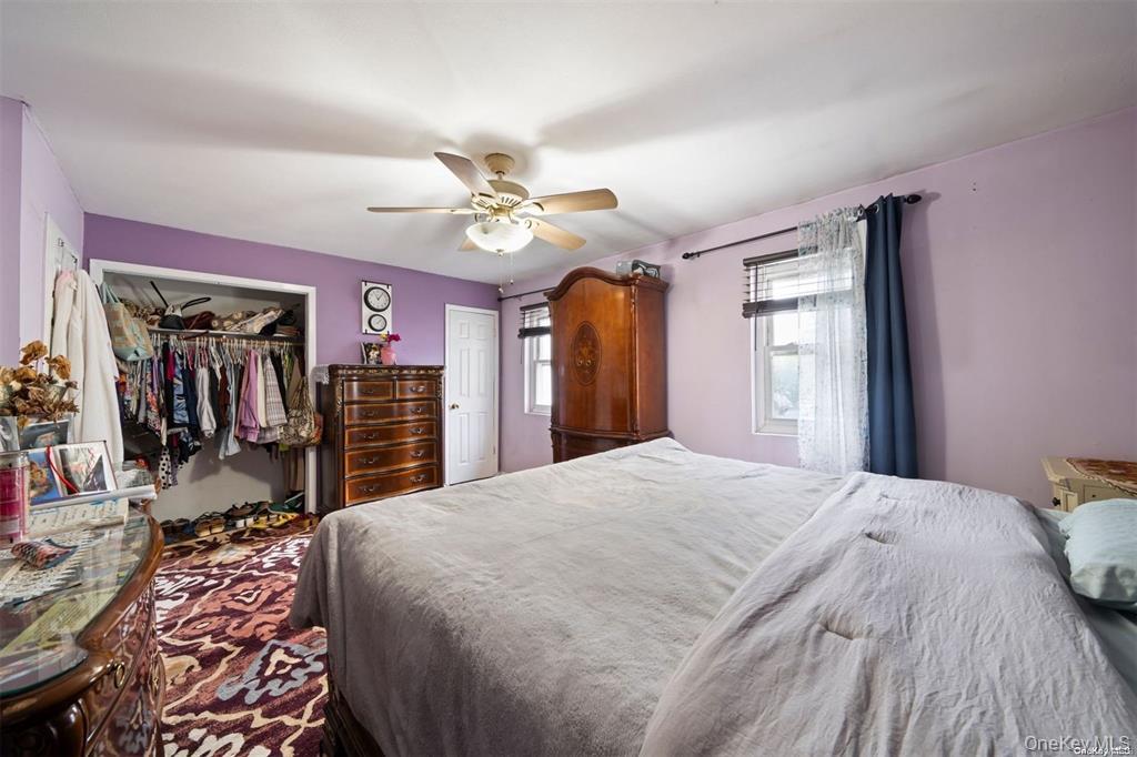 41 Woodcrest Road Staten Island, NY 10303 - Photo 9 of 21 a bed room with a bed and a large mirror