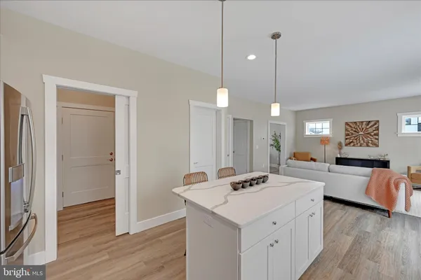 a view of a kitchen counter space and living room