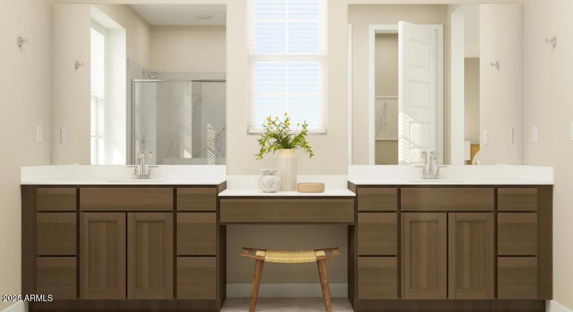 16386 West Weeping Willow Road Surprise, AZ 85387 - Photo 10 of 22 a bathroom with a sink and a window