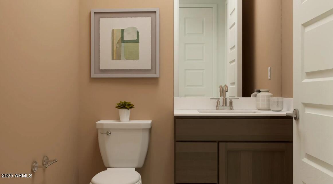 16386 West Weeping Willow Road Surprise, AZ 85387 - Photo 18 of 22 a bathroom with a toilet sink and mirror