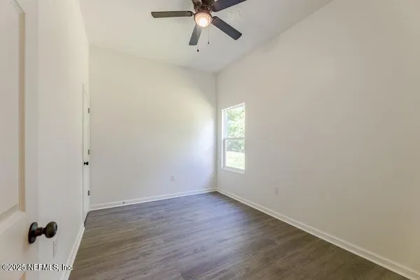 a view of an empty room with a window