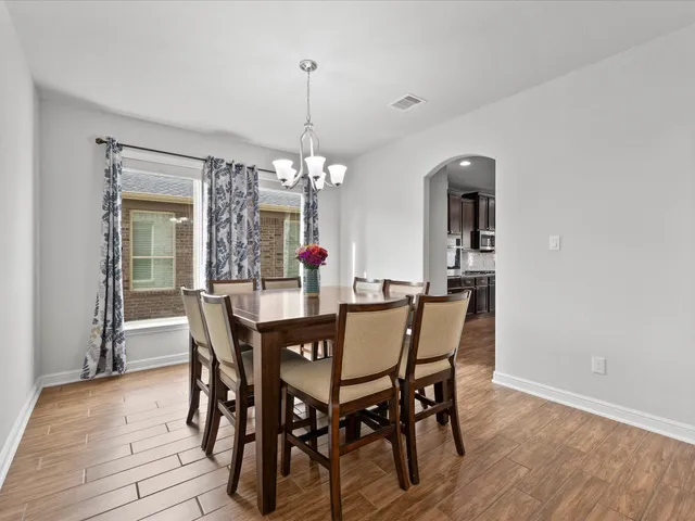a bath tub sitting next to a en suite bathroom sink and a shower