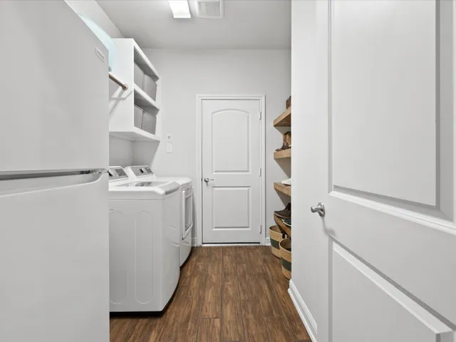 a bedroom with a bed and a ceiling fan