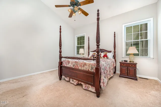 a bed room with a bed and a window