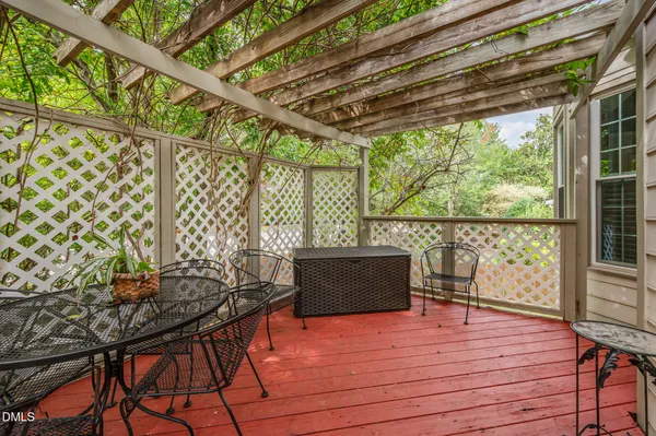 a view of a patio with wooden floor