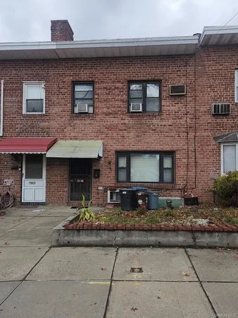 a front view of a house with yard