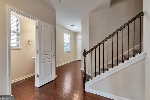 a view of an entryway with wooden floor