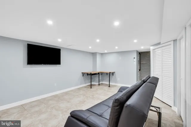 a picture of a bathroom with a white wall