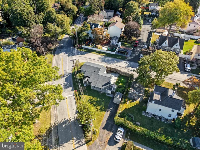 a view of the house with a yard