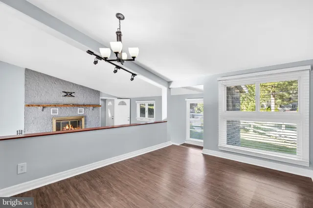 a kitchen with stainless steel appliances a refrigerator sink and cabinets