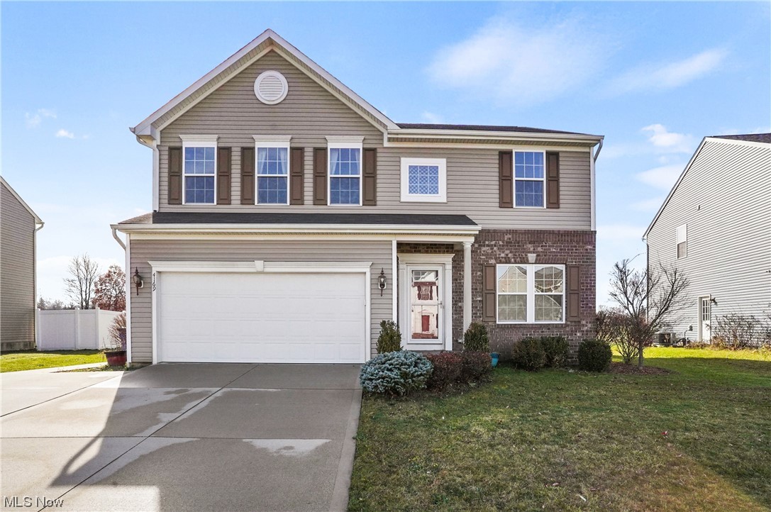 4169 Whitestone Road Kent, OH 44240 - Photo 1 of 33 View of property featuring a garage and a front lawn