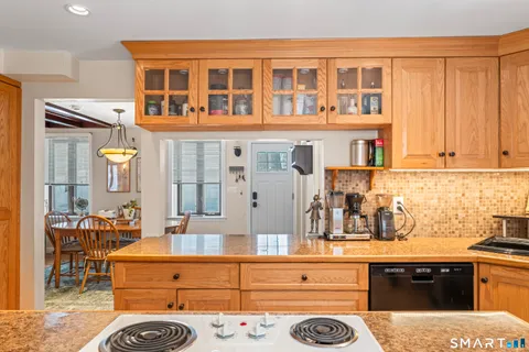 a living room with furniture and next to a window