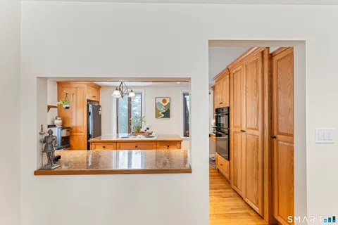 view of living room with furniture and large window