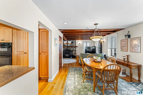 a dining room with furniture and window