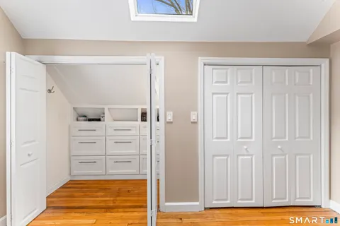 a bathroom with a sink toilet and window