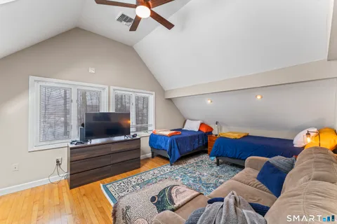 a living room with furniture and a rug