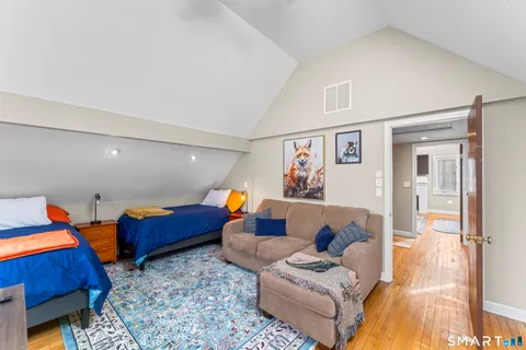 a bedroom with a bed and furniture