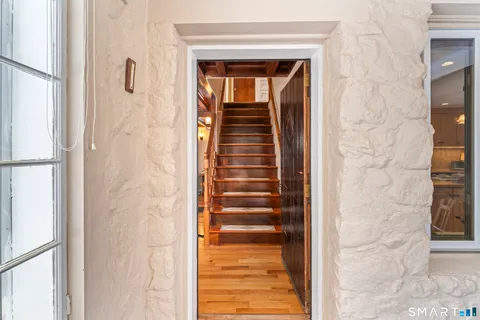 a view of a hallway with stairs