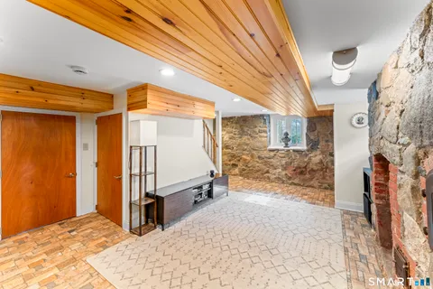 a kitchen with white cabinets and sink