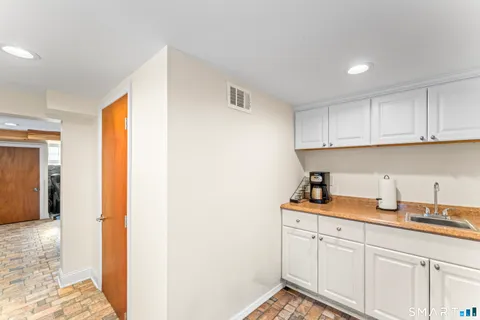 a kitchen with cabinets and window