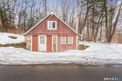 a black white and white photo of a living room