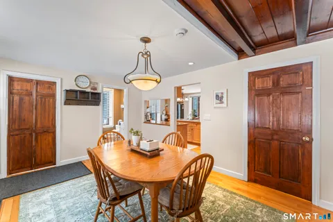 a view of a dining room with furniture and window