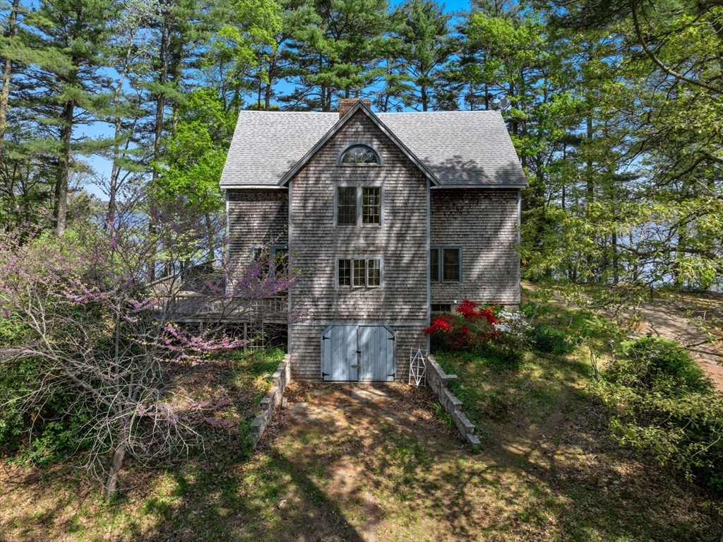 362 Snows Pond Road Rochester, MA 02770 - Photo 30 of 41 a front view of a house with garden