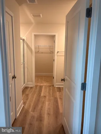 a view of a room with racks on the wall