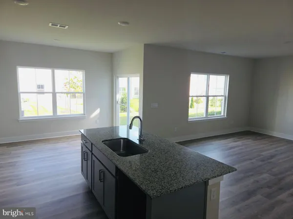 a kitchen with sink and window