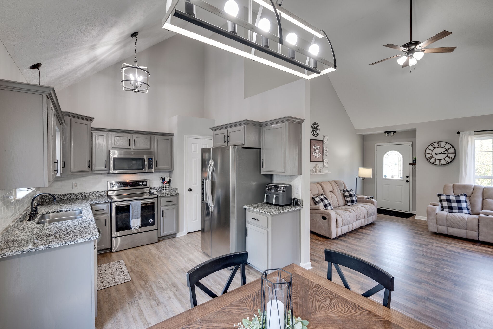 307 Red Bud Court Springfield, TN 37172 - Photo 11 of 33 a large kitchen with a table chairs refrigerator and cabinets