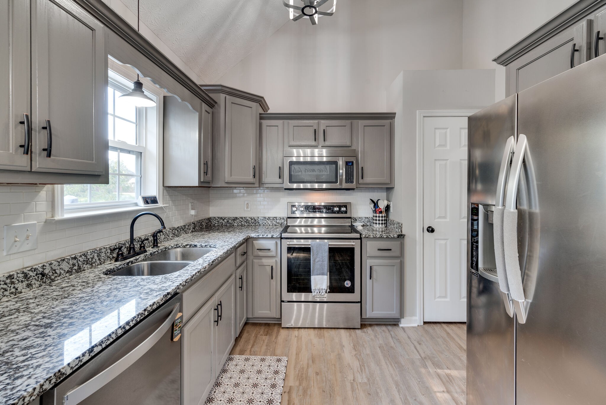 307 Red Bud Court Springfield, TN 37172 - Photo 12 of 33 a kitchen with stainless steel appliances granite countertop a sink stove and refrigerator