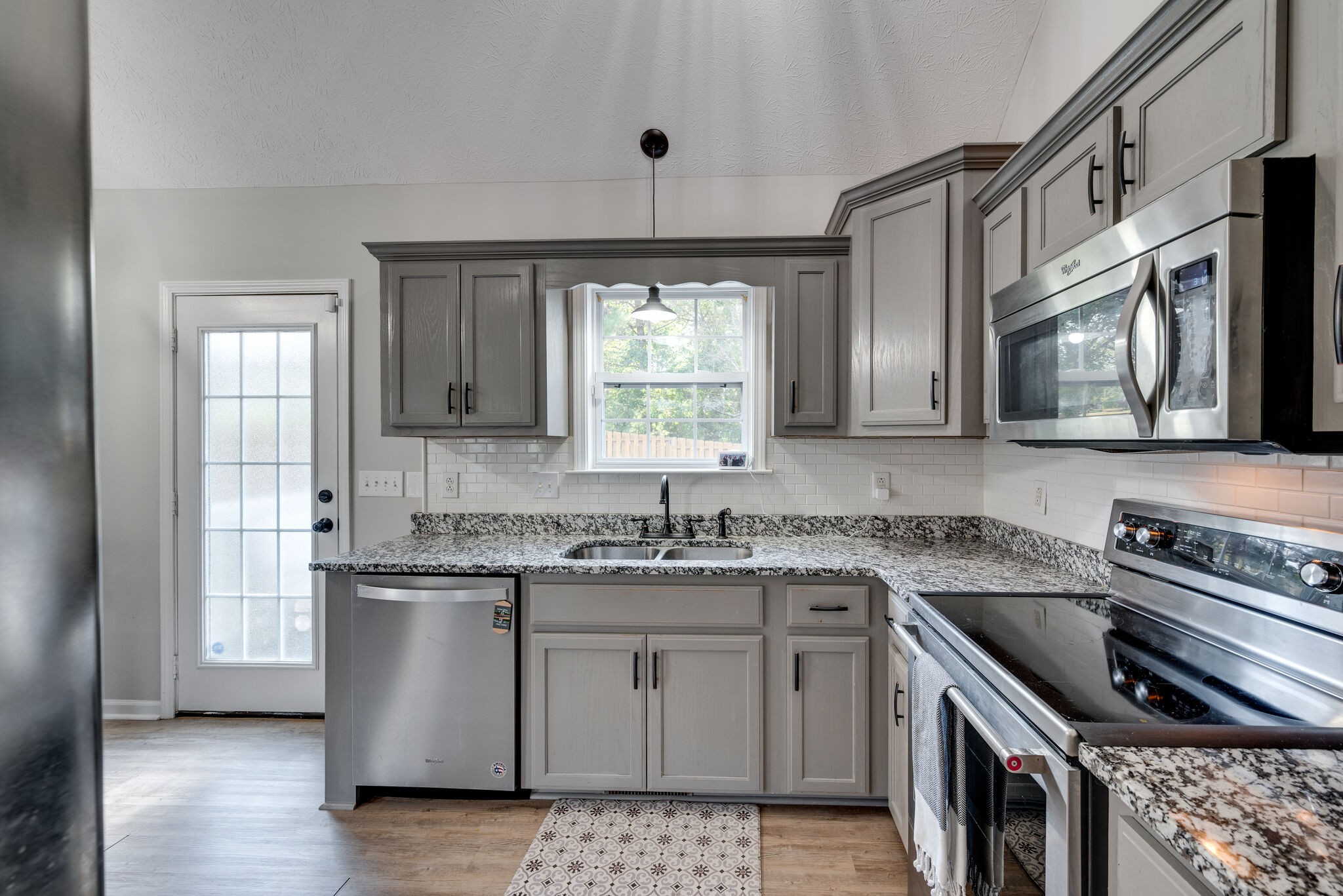 307 Red Bud Court Springfield, TN 37172 - Photo 13 of 33 a kitchen with stainless steel appliances a sink stove and cabinets