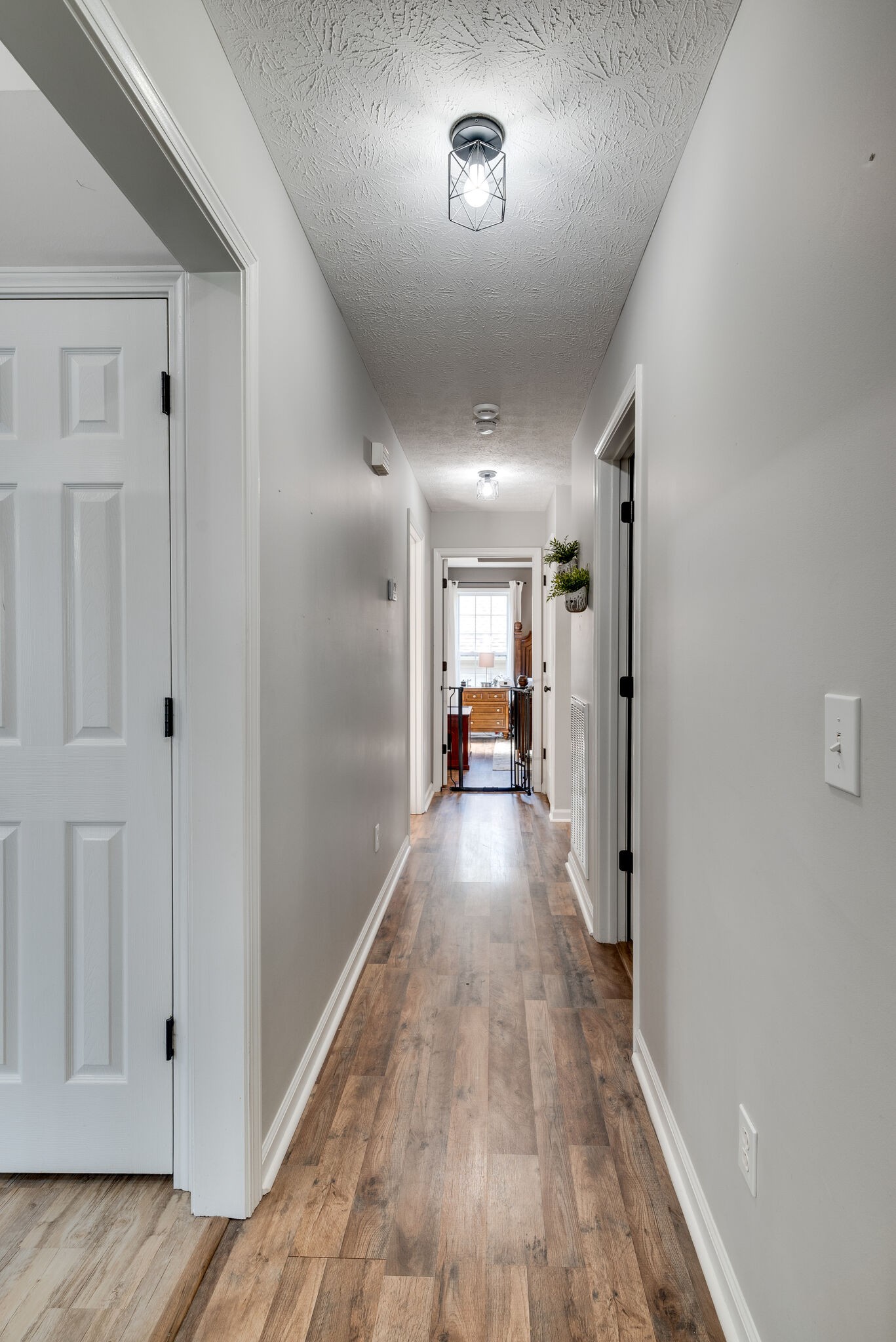 307 Red Bud Court Springfield, TN 37172 - Photo 14 of 33 a view of a hallway view with wooden floor and furniture