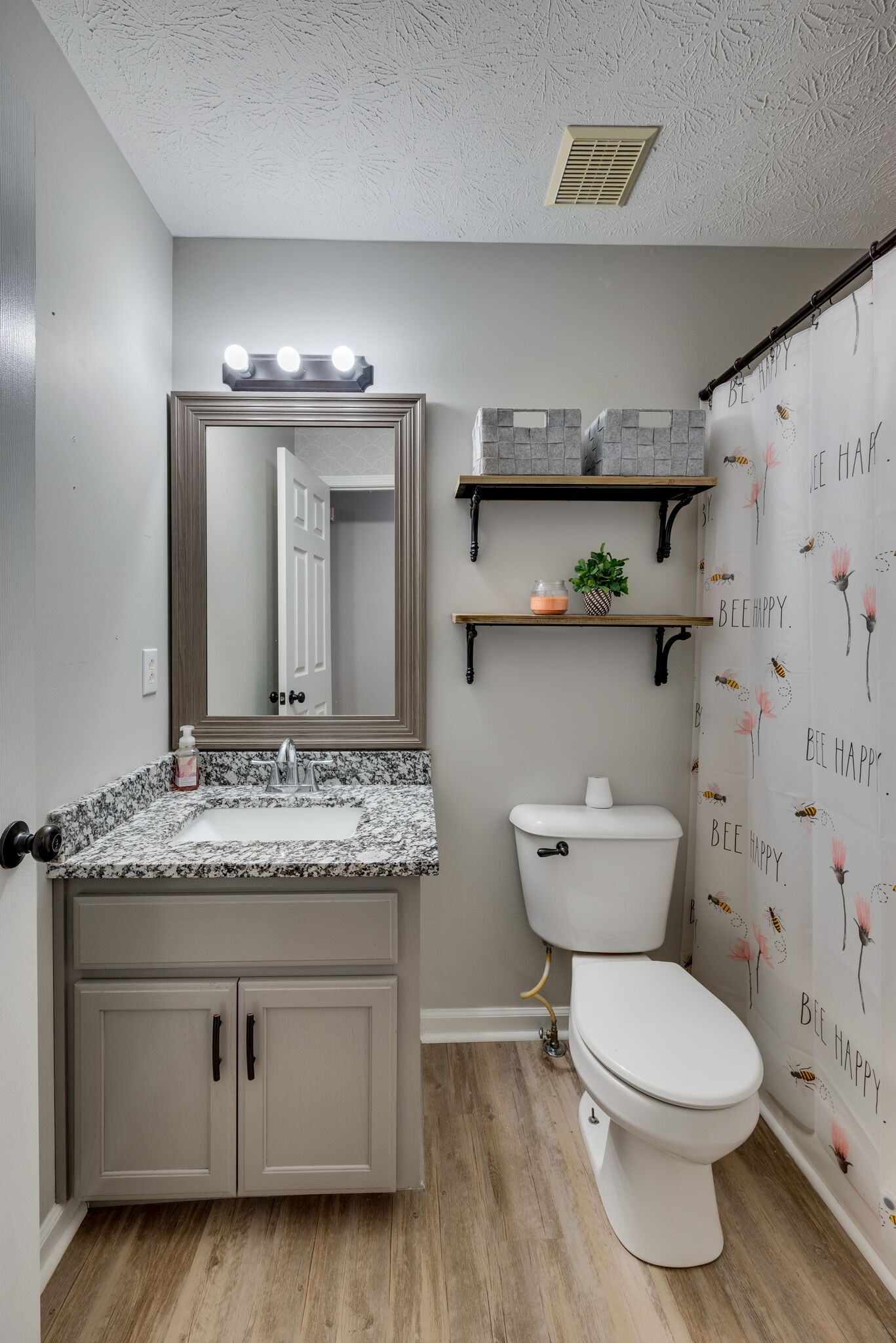 307 Red Bud Court Springfield, TN 37172 - Photo 15 of 33 a bathroom with a granite countertop toilet sink and mirror