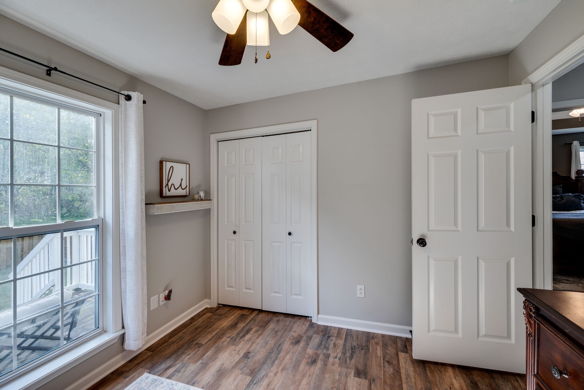 307 Red Bud Court Springfield, TN 37172 - Photo 17 of 33 a view of an empty room with wooden floor and a window