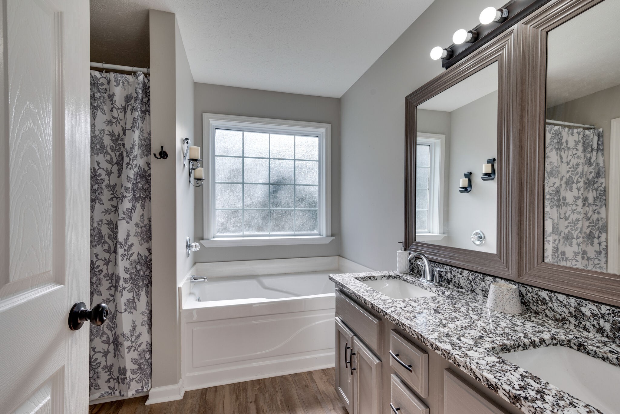 307 Red Bud Court Springfield, TN 37172 - Photo 20 of 33 a bathroom with a granite countertop sink and a mirror