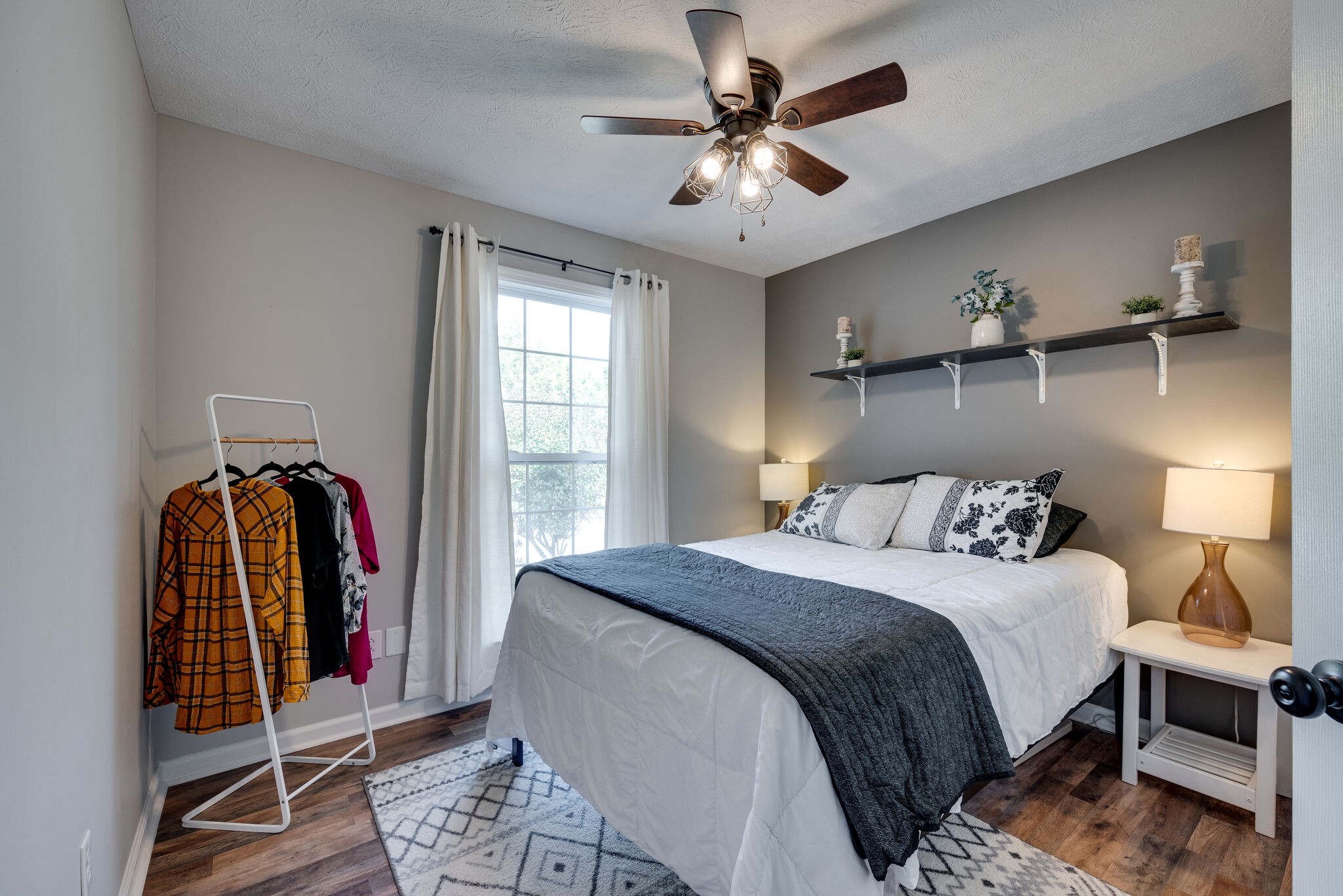 307 Red Bud Court Springfield, TN 37172 - Photo 23 of 33 a bedroom with a bed a chandelier and a window