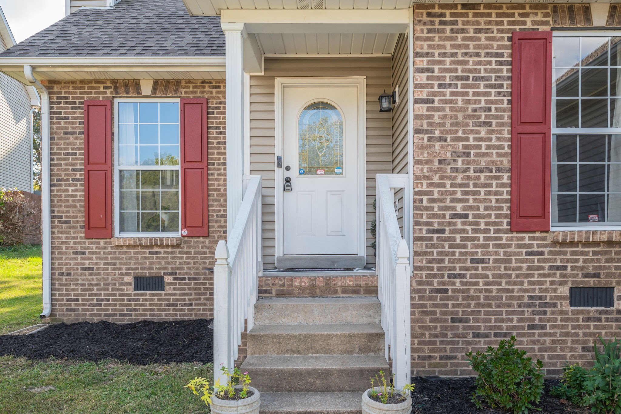 307 Red Bud Court Springfield, TN 37172 - Photo 4 of 33 a front view of a house with a garden