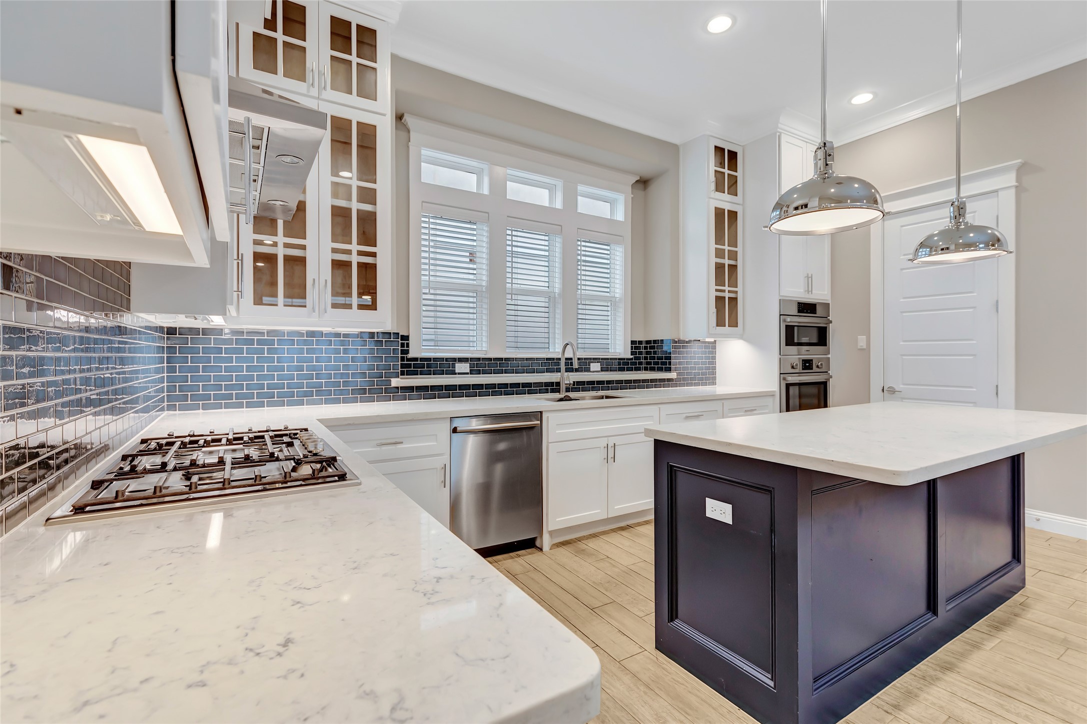 2810 Princeton Street Houston, TX 77009 - Photo 13 of 31 a kitchen with stainless steel appliances granite countertop a stove a sink dishwasher a refrigerator and a dining table with wooden floor