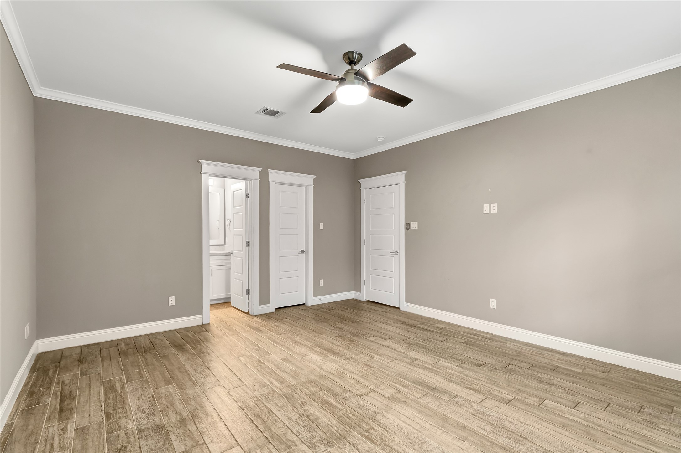 2810 Princeton Street Houston, TX 77009 - Photo 21 of 31 an empty room with wooden floor and ceiling fan