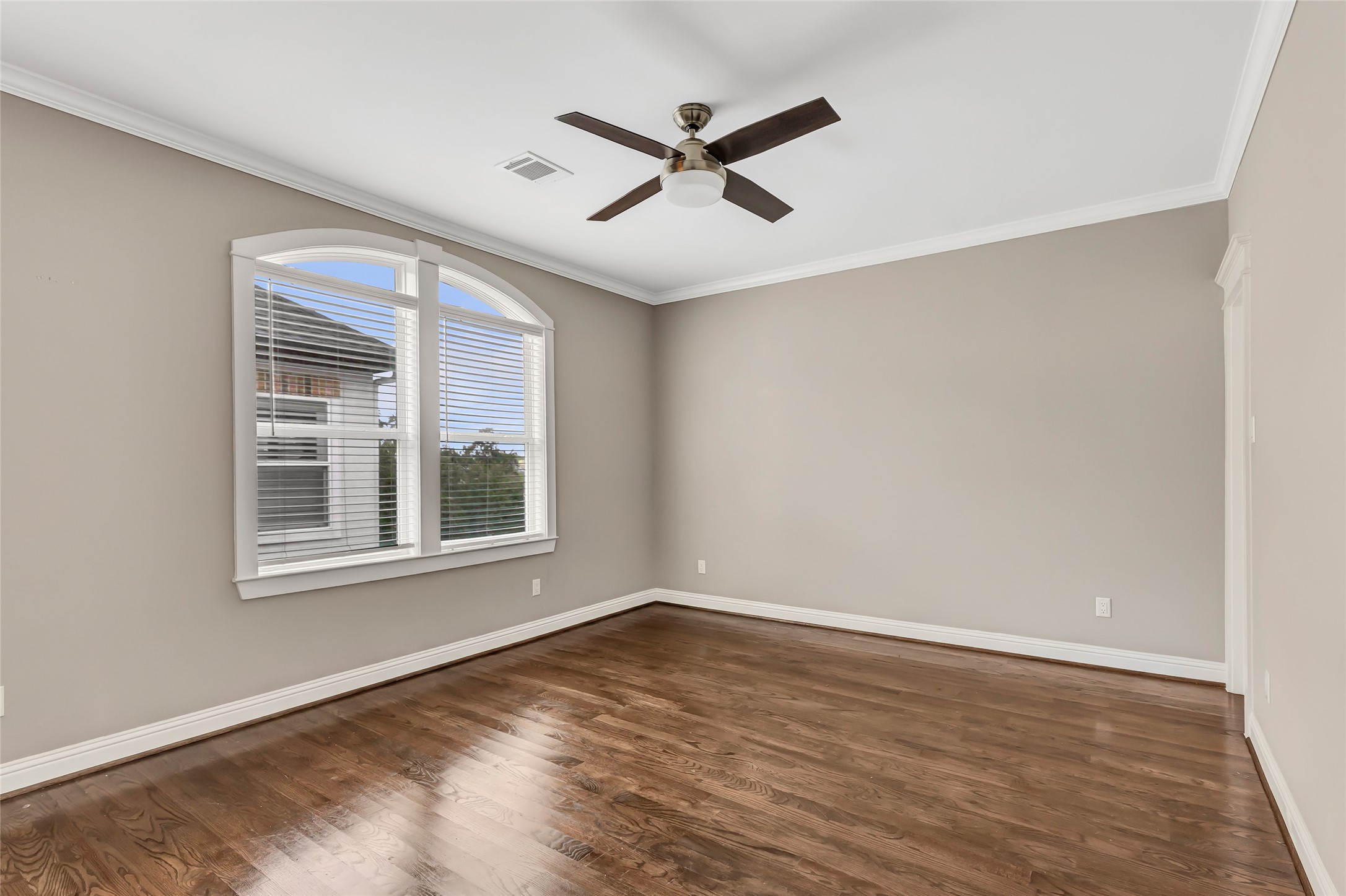 2810 Princeton Street Houston, TX 77009 - Photo 24 of 31 a view of a livingroom with a ceiling fan and wooden floor