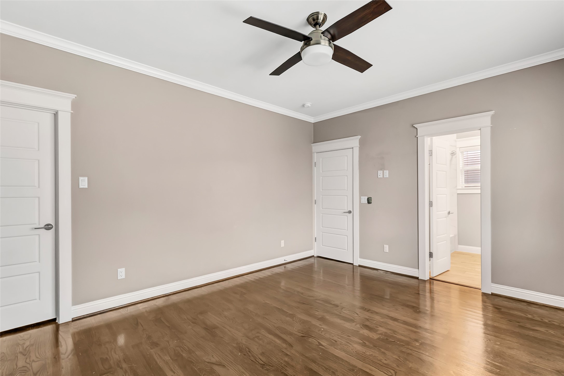 2810 Princeton Street Houston, TX 77009 - Photo 25 of 31 an empty room with wooden floor and a ceiling fan