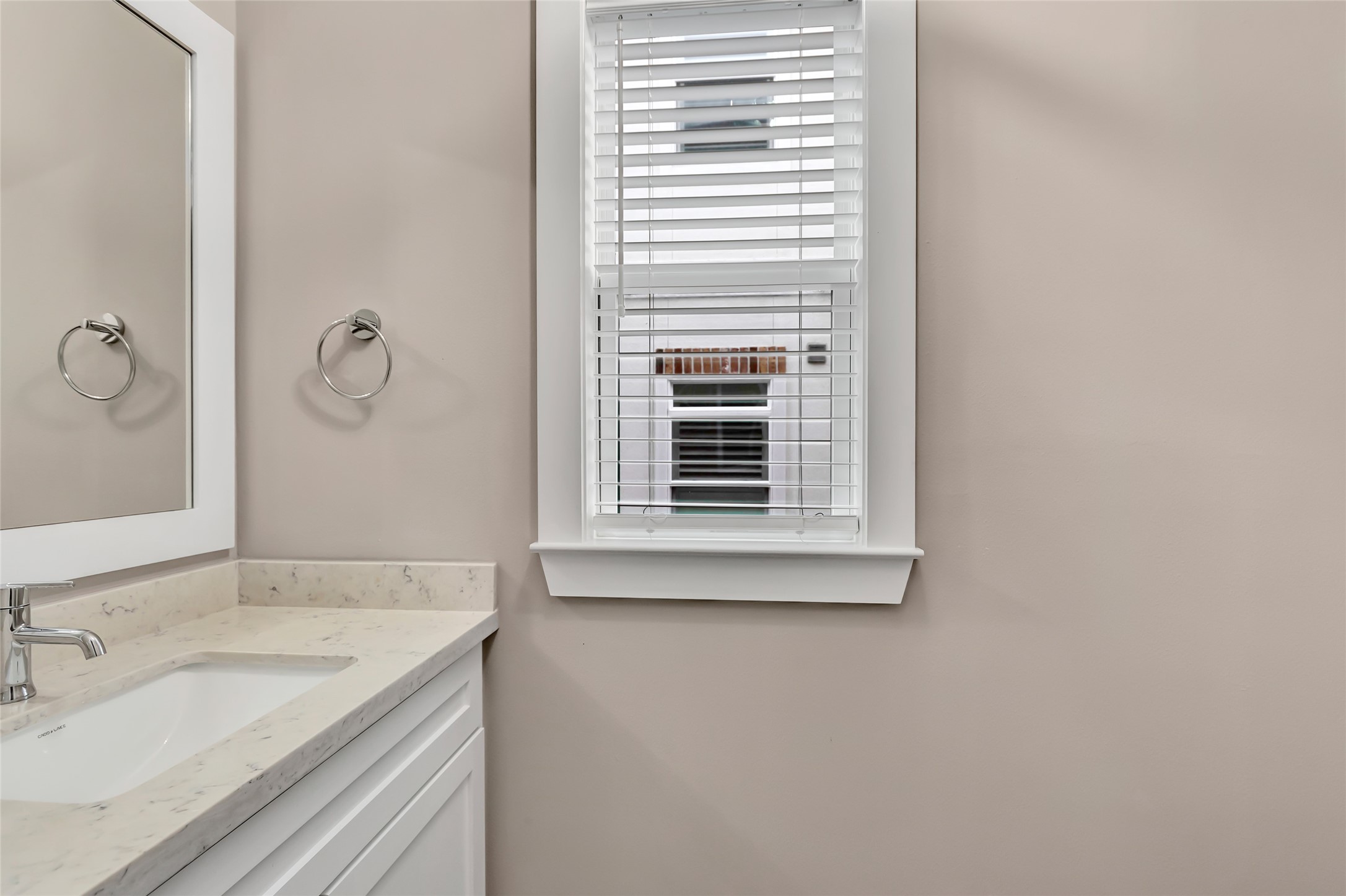 2810 Princeton Street Houston, TX 77009 - Photo 29 of 31 a bathroom with a granite countertop sink and a mirror